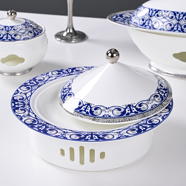 The serving dish is crafted from high-quality bone china, known for its lightweight yet durable properties, making it an ideal choice for upscale hotels and restaurants.