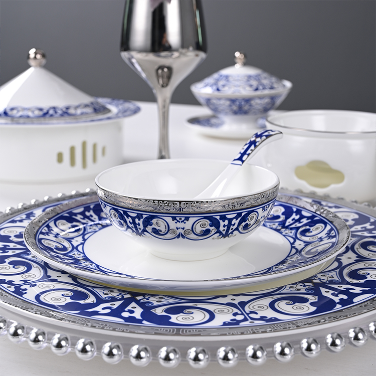 The bowl and spoon are adorned with intricate blue patterns that exude a sense of timeless elegance and sophistication.