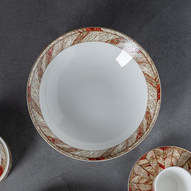 The image showcases an elegant bowl, crafted from high-quality bone china and adorned with intricate red and gold patterns.