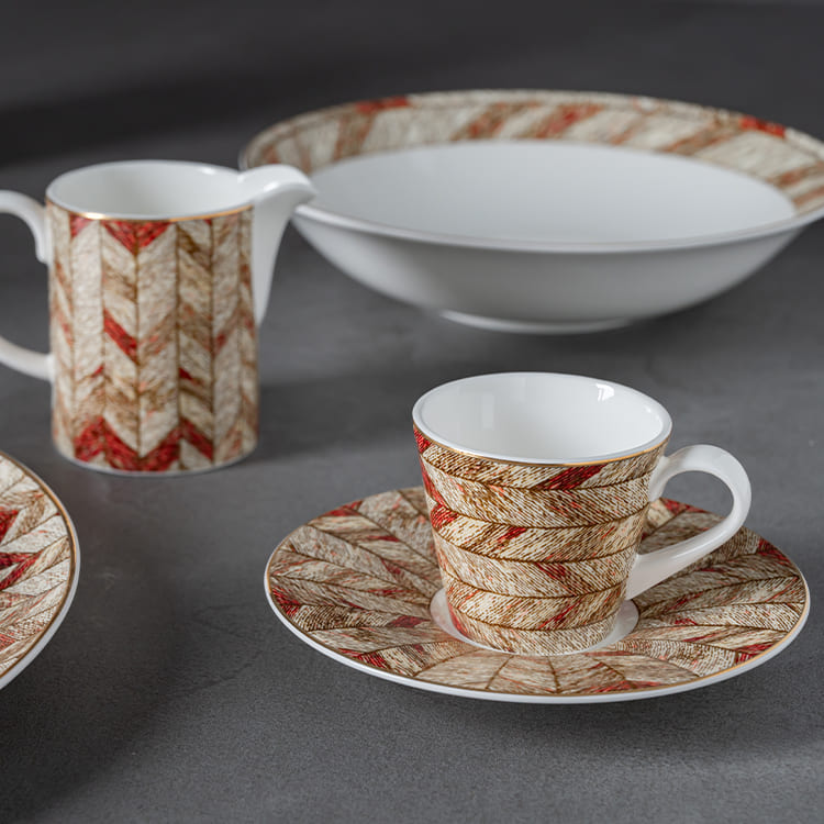 This image showcases a luxurious modern dinnerware set crafted from high-quality bone china, featuring an intricate decal design that exudes elegance and sophistication.