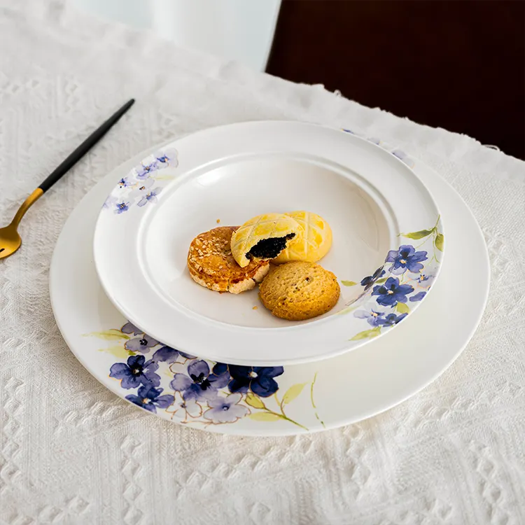This image features a dessert plate from the blue floral bone china collection, elegantly displaying a selection of cookies.