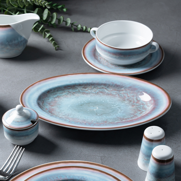 This image showcases a beautifully crafted porcelain tableware set, featuring a harmonious blend of blue and earthy tones.