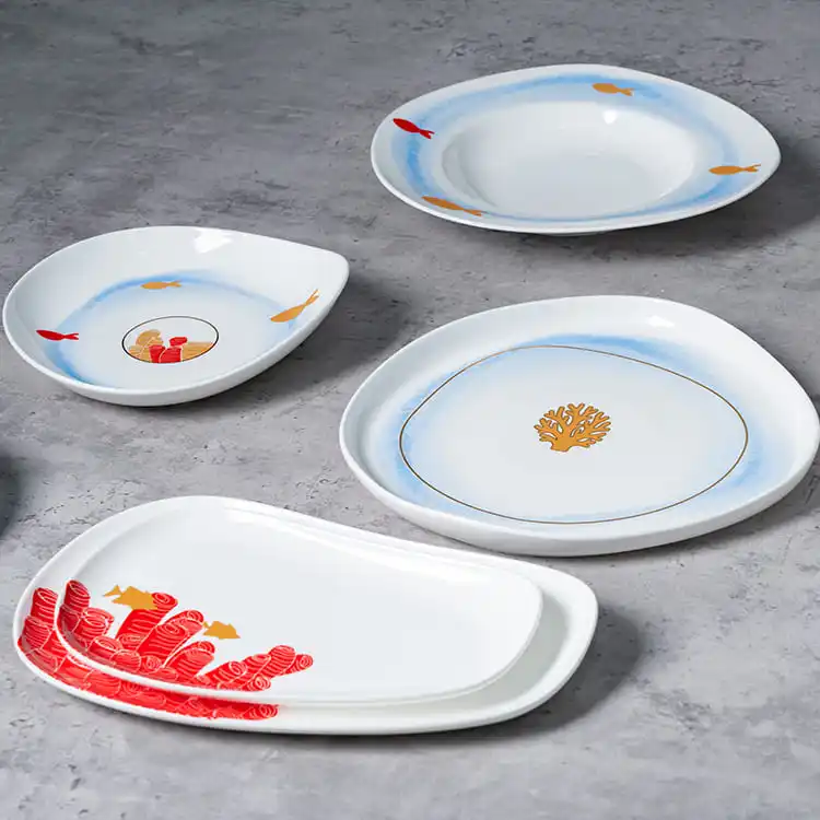 This image features a selection of plates and bowls from the Coral Reef Dinnerware set, highlighting the intricate coral and fish designs.