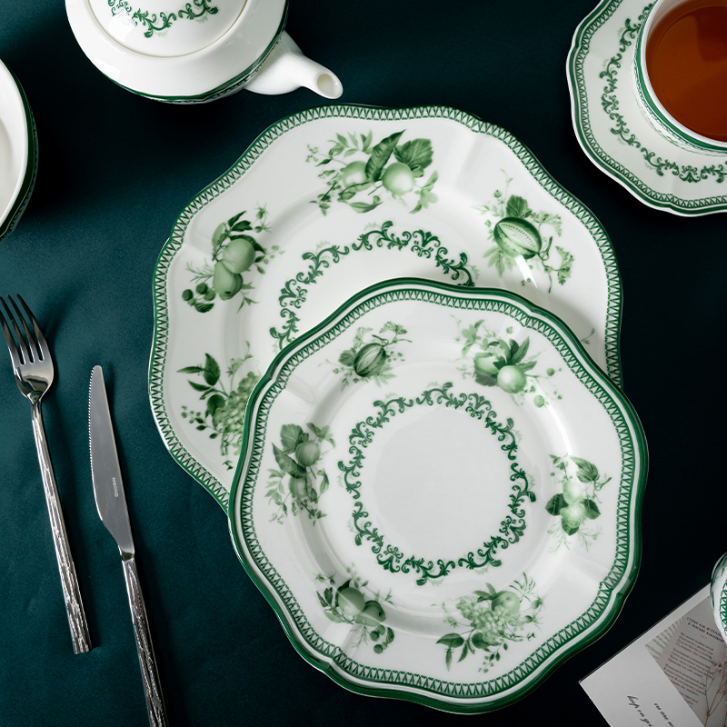 The image showcases a luxurious dining arrangement featuring the green floral decal dinnerware set.
