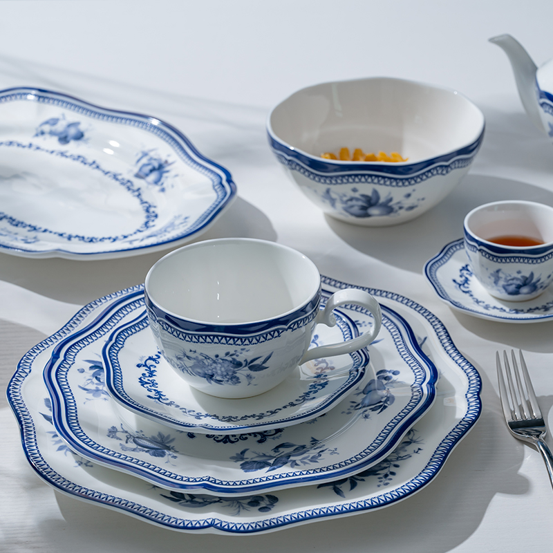 This image presents a complete blue flower porcelain dinner set, including plates, bowls, cups, and saucers.
