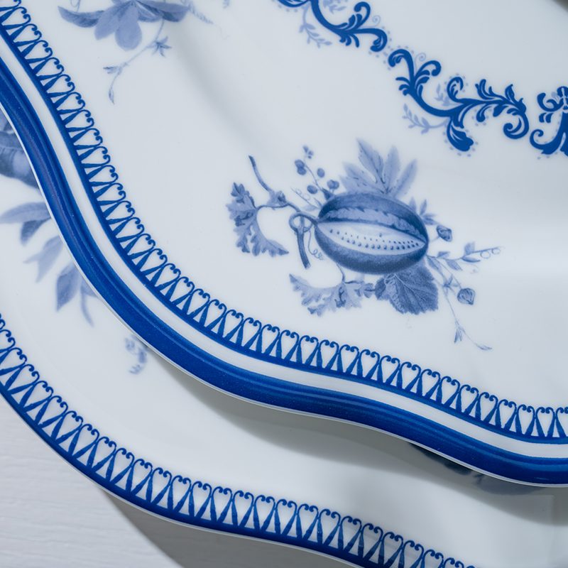 This close-up image highlights the intricate details of a blue flower porcelain plate.