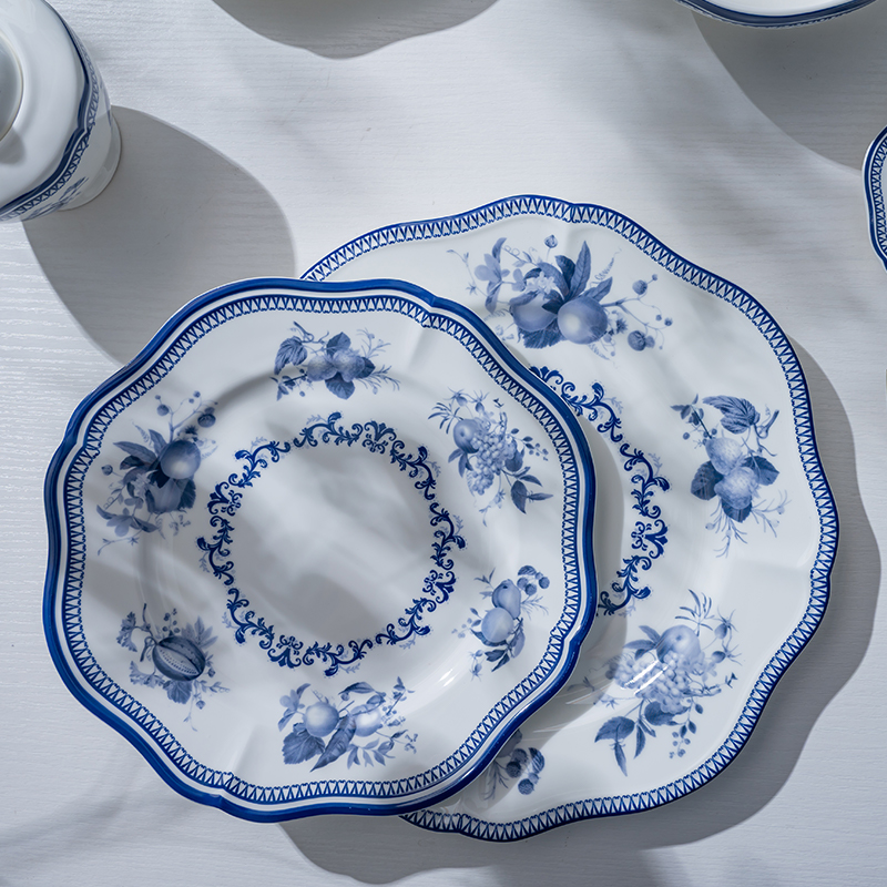 This image showcases two intricately designed blue flower porcelain dinner plates.