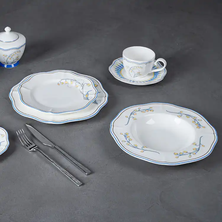 This image captures a beautifully arranged table setting featuring the lily of the valley dinnerware collection.