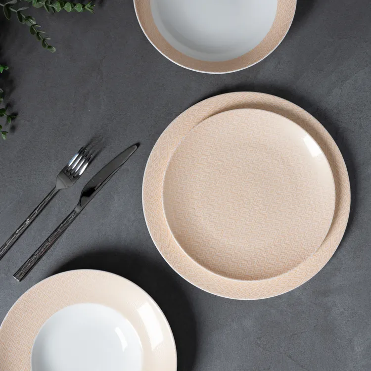 This image showcases a dinnerware set featuring a subtle beige pattern, made from high-quality bone china.