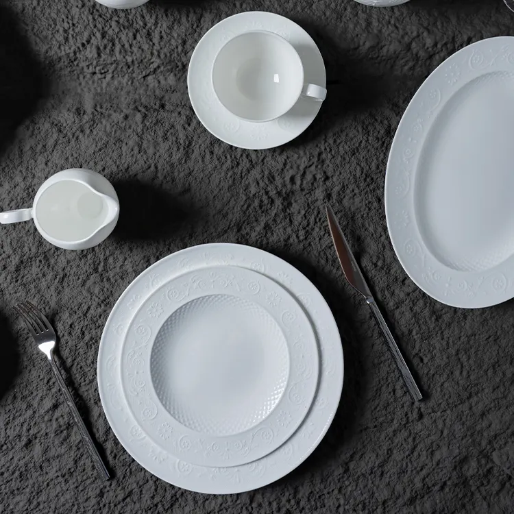 The image presents a sophisticated dining setup featuring a white bone china dinner set.