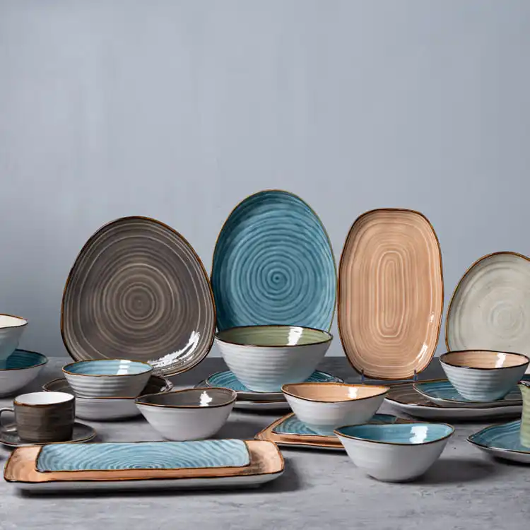 This image displays a complete collection of spiral pattern porcelain serving dishes, including plates, bowls, and cups in various sizes and shapes.