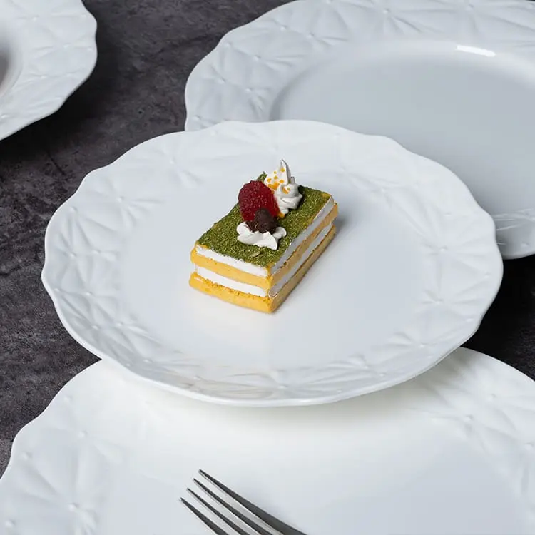 This image showcases a beautifully crafted dessert placed on a white bone china plate.