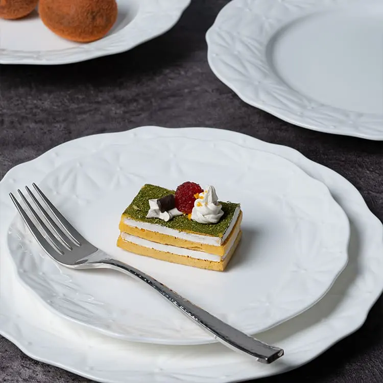 This image features a refined dessert display on a white bone china plate.
