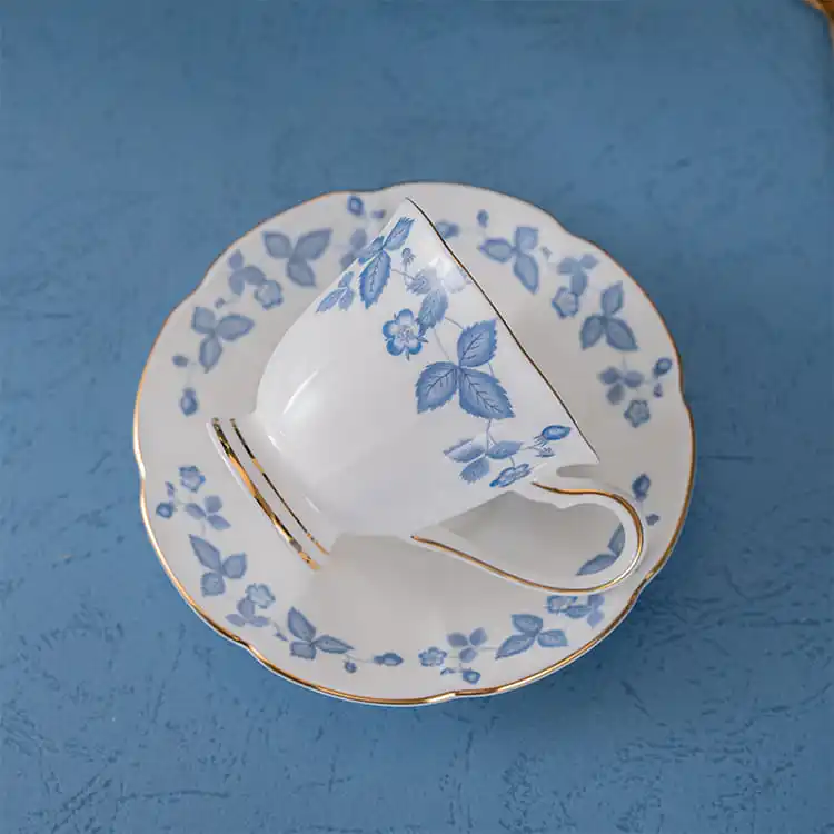 Blue floral bone china tea cup with gold rim