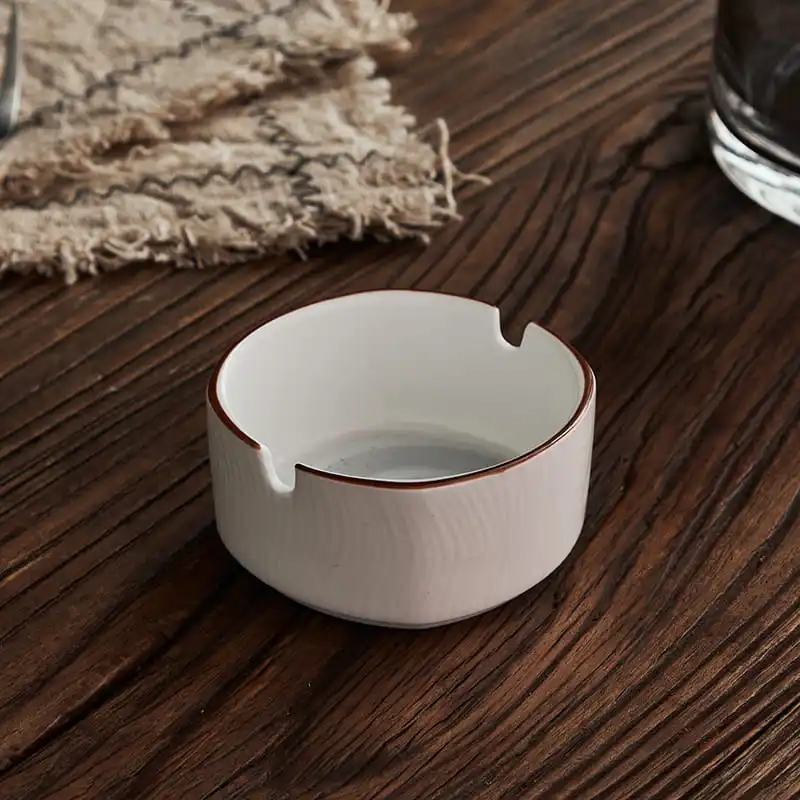 White bone china round ashtray with brown rim