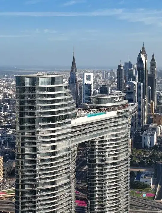 Aerial daytime shot of Address Sky View Dubai towers featuring the rooftop infinity pool.