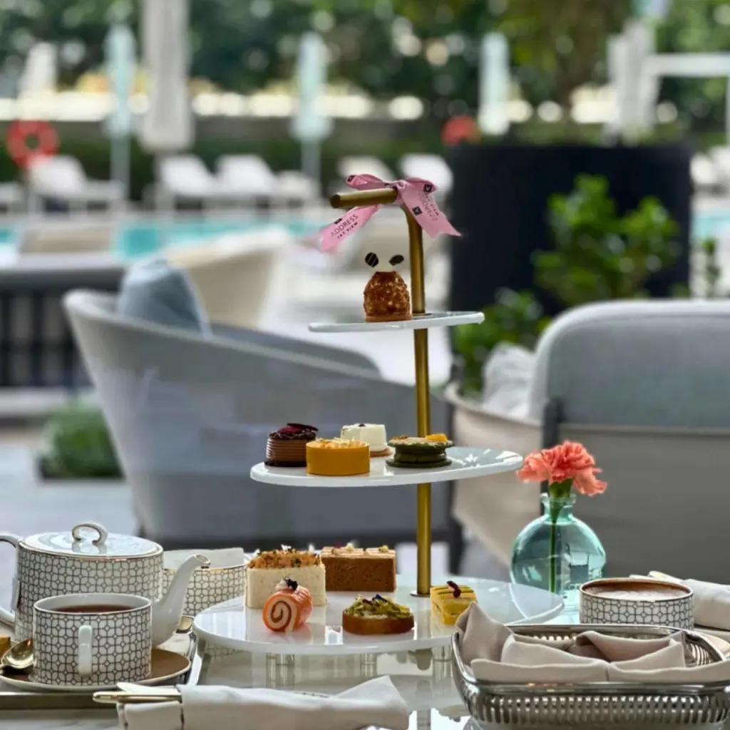Afternoon tea service at Address Sky View set with PITO custom teapot, cups, and tiered pastry stand.