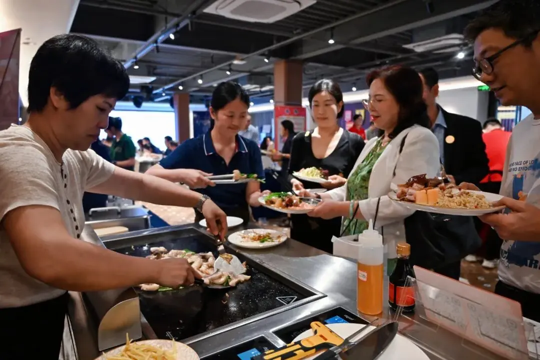 Guests select food on PITO tableware at the themed hospitality marketplace.