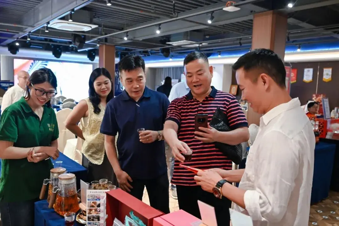 Participants enjoy tea tasting and network at the event marketplace.